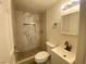 Updated bathroom with marble shower and modern vanity at 6124 Jones Cir, Las Vegas, NV 89107