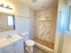 Updated bathroom with marble shower and white vanity at 6124 Jones Cir, Las Vegas, NV 89107