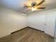 Bright bedroom with ceiling fan and wood-look floors at 6124 Jones Cir, Las Vegas, NV 89107