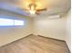 Bright bedroom with ceiling fan and wood-look floors at 6124 Jones Cir, Las Vegas, NV 89107