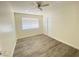 Bright bedroom with wood-look floors and ceiling fan at 6124 Jones Cir, Las Vegas, NV 89107