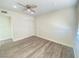 Spacious bedroom with wood-look floors and ceiling fan at 6124 Jones Cir, Las Vegas, NV 89107