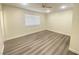 Spacious bedroom with wood-look flooring and window at 6124 Jones Cir, Las Vegas, NV 89107