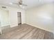 Spacious bedroom with wood-look floors and ceiling fan at 6124 Jones Cir, Las Vegas, NV 89107