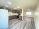 Modern kitchen with dark brown cabinets and quartz countertops at 6124 Jones Cir, Las Vegas, NV 89107