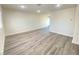 Spacious living area with gray vinyl flooring and recessed lighting at 6124 Jones Cir, Las Vegas, NV 89107