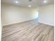 Spacious living area with gray vinyl flooring and recessed lighting at 6124 Jones Cir, Las Vegas, NV 89107