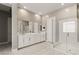 Luxurious bathroom with double vanity, large mirror, and walk-in shower at 6188 Rockville Creek Ct, Las Vegas, NV 89149