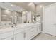 Elegant bathroom with double vanity and walk-in shower at 6188 Rockville Creek Ct, Las Vegas, NV 89149