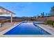 Blue illuminated pool and spa with pergola at night at 6188 Rockville Creek Ct, Las Vegas, NV 89149