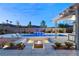 Elevated view of a luxurious pool and spa area at night at 6188 Rockville Creek Ct, Las Vegas, NV 89149