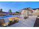 Expansive pool and spa with fire pit and pergola at 6188 Rockville Creek Ct, Las Vegas, NV 89149