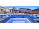 Luxury pool and spa with built-in seating and hot tub at 6188 Rockville Creek Ct, Las Vegas, NV 89149