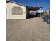 Tan mobile home with covered porch and large windows, front yard view at 6214 Mount Rainier Ave, Las Vegas, NV 89156