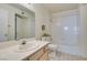 Clean bathroom with white tile and a shower/tub combo at 698 S Racetrack Rd # 711, Henderson, NV 89015