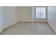 Spacious bedroom with neutral carpeting and ample natural light at 698 S Racetrack Rd # 711, Henderson, NV 89015