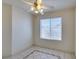 Bright dining area with tile flooring, a ceiling fan, and a window providing natural light at 698 S Racetrack Rd # 711, Henderson, NV 89015