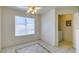 Dining area with tile flooring, ceiling fan, window, and access to laundry at 698 S Racetrack Rd # 711, Henderson, NV 89015