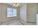 Dining area features tile flooring, ceiling fan, and bright window at 698 S Racetrack Rd # 711, Henderson, NV 89015