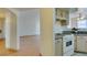 Kitchen with white cabinetry, granite countertops, and a view into a large living area at 698 S Racetrack Rd # 711, Henderson, NV 89015