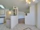 Bright dining area leading into the kitchen with tile flooring, and neutral walls at 698 S Racetrack Rd # 711, Henderson, NV 89015