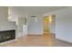 Bright living room features light-colored wood flooring and a cozy tile fireplace at 698 S Racetrack Rd # 711, Henderson, NV 89015