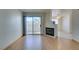 Inviting living room featuring a fireplace, sliding glass doors to balcony, and connecting dining area at 698 S Racetrack Rd # 711, Henderson, NV 89015