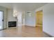 Living room with hardwood floors, fireplace and sliding glass door to patio at 698 S Racetrack Rd # 711, Henderson, NV 89015