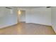 An empty living area with wood-look floors and views to other rooms at 698 S Racetrack Rd # 711, Henderson, NV 89015