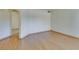 An empty living area featuring wood-look flooring and views to other rooms at 698 S Racetrack Rd # 711, Henderson, NV 89015