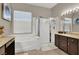 Bathroom with soaking tub, walk-in shower, and double vanity at 7291 Purple Shadow Ave, Las Vegas, NV 89113