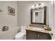 Small bathroom with granite vanity and updated fixtures at 7291 Purple Shadow Ave, Las Vegas, NV 89113