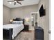 Spacious bedroom with a TV, ceiling fan, and ensuite bathroom at 7291 Purple Shadow Ave, Las Vegas, NV 89113