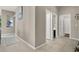 Bright hallway with tile floors and access to bedrooms at 7291 Purple Shadow Ave, Las Vegas, NV 89113