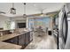 Kitchen with breakfast bar, stainless steel appliances, and granite counters at 7291 Purple Shadow Ave, Las Vegas, NV 89113