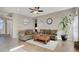 Spacious living room featuring hardwood floors and a ceiling fan at 7291 Purple Shadow Ave, Las Vegas, NV 89113