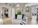 Living room with large TV, fireplace and view into kitchen and dining area at 7291 Purple Shadow Ave, Las Vegas, NV 89113