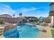 Stunning pool with a rock waterfall and patio at 7291 Purple Shadow Ave, Las Vegas, NV 89113