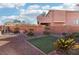 Backyard with artificial turf, fire pit, and rock landscaping at 772 Crimson Peak Pl, Henderson, NV 89011