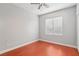 Simple bedroom with wood floors and a window at 772 Crimson Peak Pl, Henderson, NV 89011