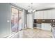 Kitchen with white cabinets, granite countertops and view of backyard at 772 Crimson Peak Pl, Henderson, NV 89011