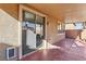 Covered patio with sliding glass door and pet door at 772 Crimson Peak Pl, Henderson, NV 89011