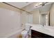 Clean bathroom with a shower/tub combo, vanity, and mirror at 7978 Coronado Coast St, Las Vegas, NV 89139