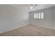 Bedroom with neutral walls, carpet, and window shutters at 7978 Coronado Coast St, Las Vegas, NV 89139