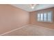 Well-lit bedroom with neutral walls and carpet flooring at 7978 Coronado Coast St, Las Vegas, NV 89139