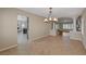 Bright dining room with tile floors and a chandelier at 7978 Coronado Coast St, Las Vegas, NV 89139