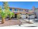 Two-story house with a three-car garage and a landscaped front yard, featuring a pool at 7978 Coronado Coast St, Las Vegas, NV 89139