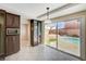 Kitchen with view of backyard pool and patio through sliding glass doors at 7978 Coronado Coast St, Las Vegas, NV 89139