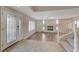 Living room with hardwood floors, a fireplace, and large windows at 7978 Coronado Coast St, Las Vegas, NV 89139