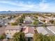 Aerial view of neighborhood with distant mountain backdrop at 8016 Roundup Ridge St, Las Vegas, NV 89131